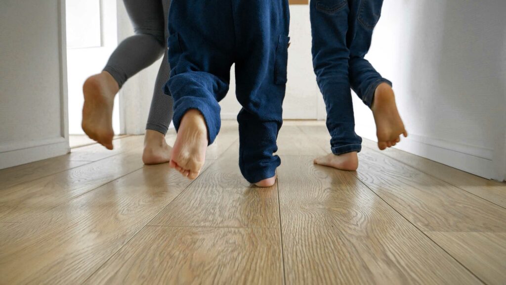 family running with laminate flooring